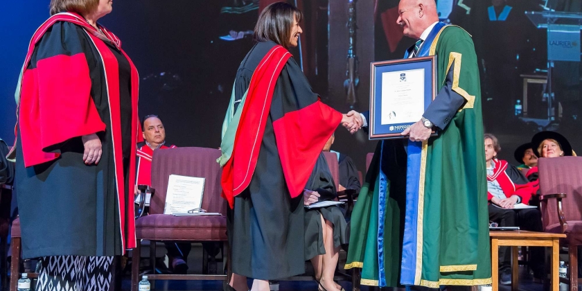 Dr. Maria Cantalini-Williams receiving award from Chancellor
