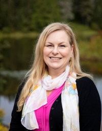 A headshot picture taken in front of the pond