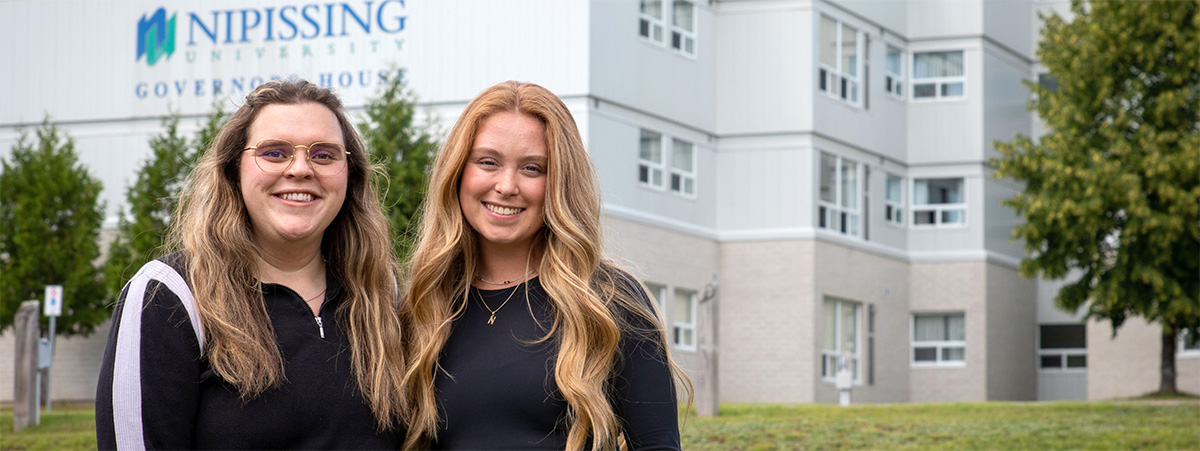 two smiling students