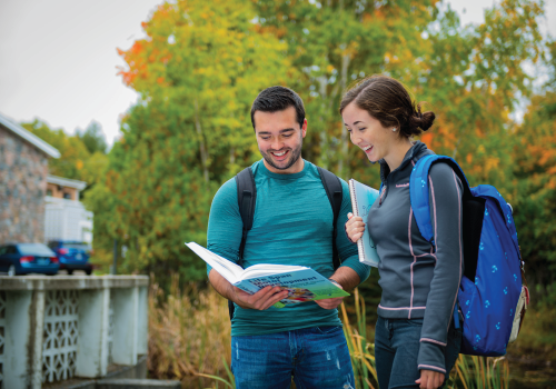 2 students chatting outside