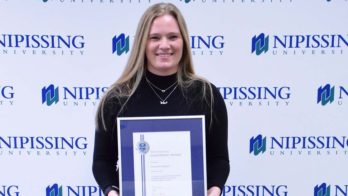 Marilyn Fortin with award