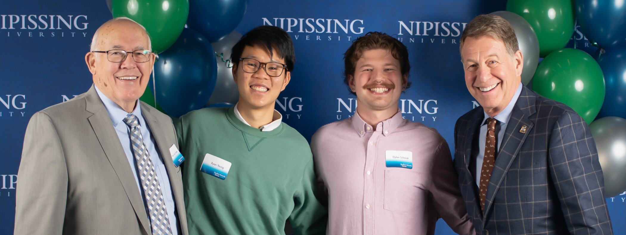 NU students pose with donor Jack Jones and Chancellor Russe;l