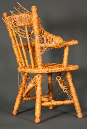 Photo of art piece featuring a chair covered in twine