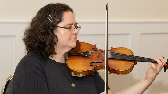 Violinist plays for guests