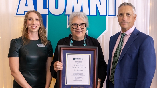 Dr. Joyce Helmer receives the Dr. James Jamieson Influential Alumni Award