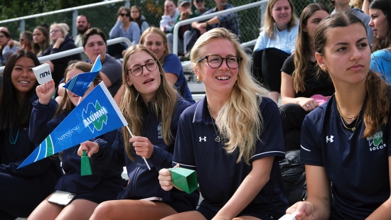 Student and alumni fans cheering on the Lakers during Homecoming weekend