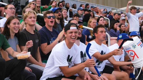 Student and alumni fans cheering on the Lakers during Homecoming weekend