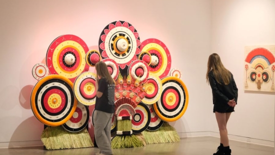 Lakers examining a big art installation during NU Homecoming 2025