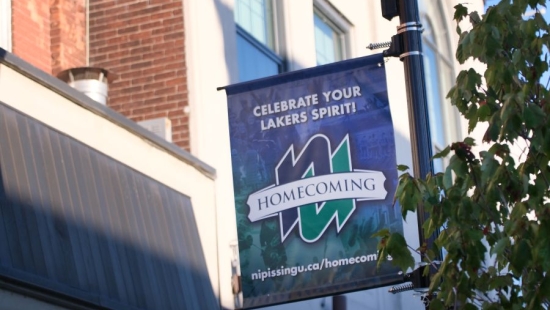 NU Homecoming 2025 flag, downtown North Bay, ON