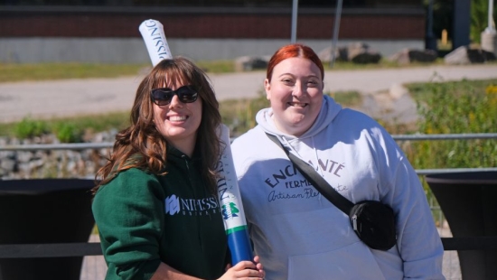 Two Lakers posing for a photo during NU Homecoming 2025