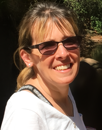 Laura Frank in front of a nature background