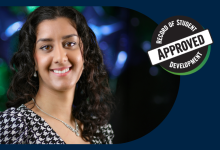 Headshot of Roshni smiling into the camera