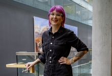 Lindsay Sullivan stands in the university library